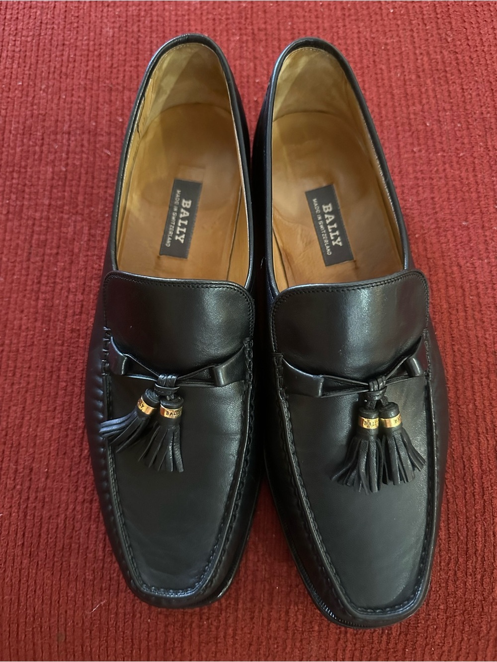 Bally Black Leather Tassel Slip-On Loafers with Gold Accents